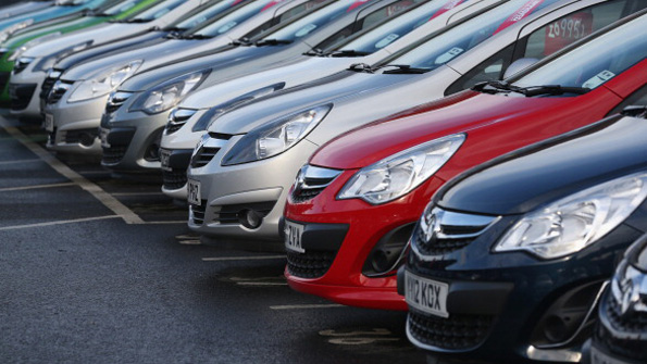 A row of cars on a European sales lot