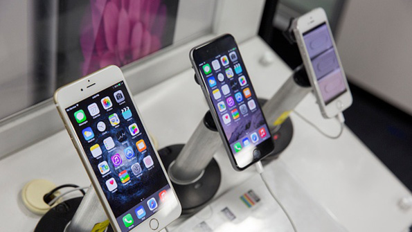 A trio of Apple iPhone 6s on sale in a retail location