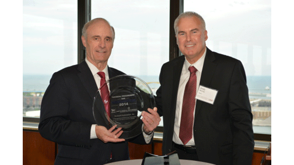 Keith Nosbusch chairman and CEO Rockwell Automation accepts the 2014 North America Procurement Supplier of the Year award for technical procurement maintenance repair and operations MRO from Andy Murray head of technical procurement Nestle