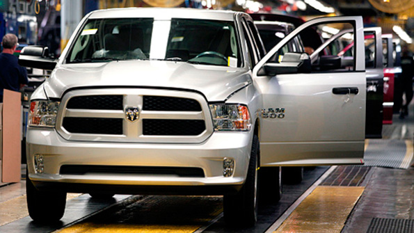 A row of 2015 Chrysler Ram 1500 trucks