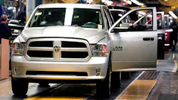 A row of 2015 Chrysler Ram 1500 trucks A row of 2015 Chrysler Ram 1500 trucks