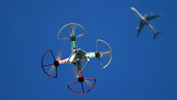 A recreational drone flies beneath a commercial airliner A recreational drone flies beneath a commercial airliner