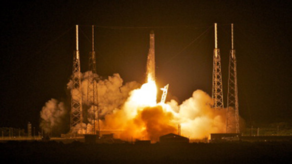 The SpaceX Dragon spacecraft launches with the Falcon 9 rocket