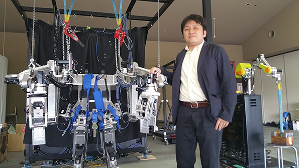 ActiveLink founder Hiromichi Fujimoto shows off his Power Effector suit