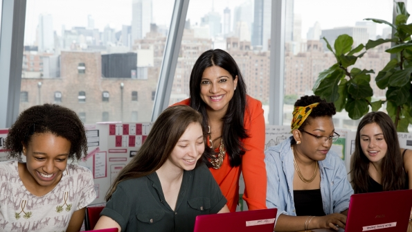 Girls Who Code founder Reshma Saujani center with some of the young women in the club