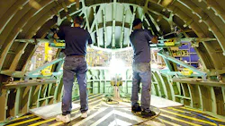 Boeing employees at work on a 777 cockpit Boeing employees at work on a 777 cockpit