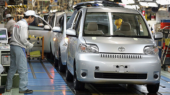Line workers assemble Toyota cars at the companys Takaoka plant