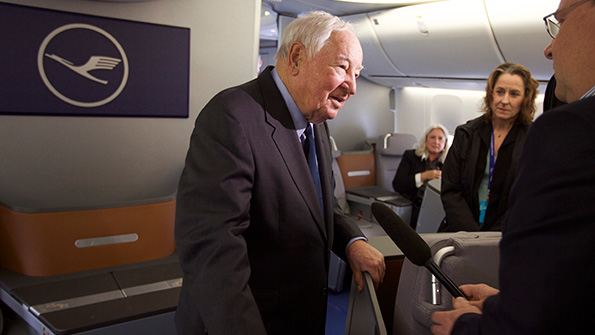 Boeing engineer Joe Sutter who led the original 747 design team aboard a 7478