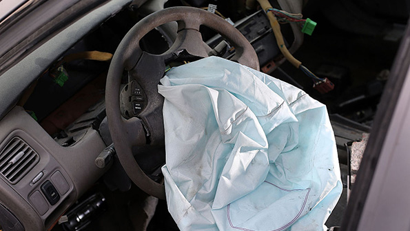 A deployed Takata airbag in a Honda sedan