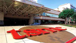 The TSMC logo in front of company headquarters The TSMC logo in front of company headquarters