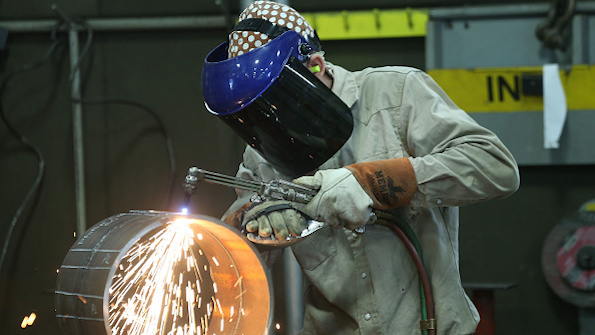 An employee welds pipe at Pioneer Pipe in Marietta Ohio The construction maintenance and fabrication company employs around 800 people supplying products to the oil and gas industry