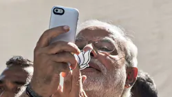 Indian prime minister Narendra Modi uses his iPhone Indian prime minister Narendra Modi uses his iPhone
