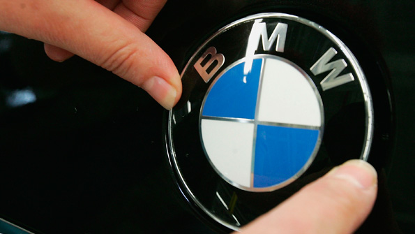 The BMW logo on a car hood