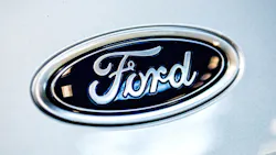 Ford script logo on a car hood Ford script logo on a car hood