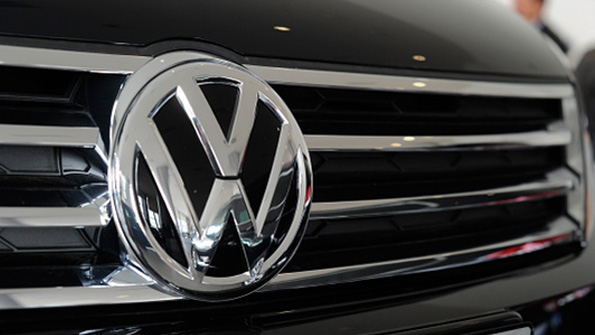 The Volkswagen logo on a car grille