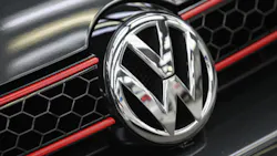 Volkswagen logo on a car grille Volkswagen logo on a car grille