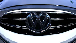 Volkswagen logo on a car grille Volkswagen logo on a car grille