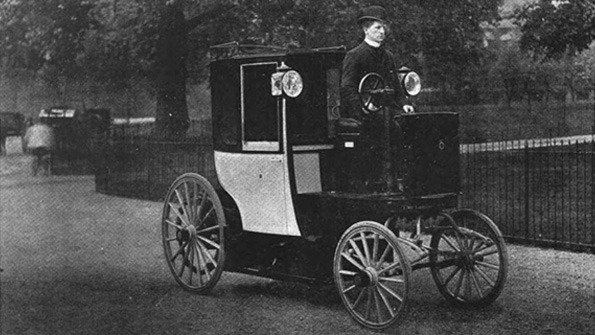An 1899 electric cab drives through London