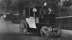 An 1899 electric cab drives through London An 1899 electric cab drives through London