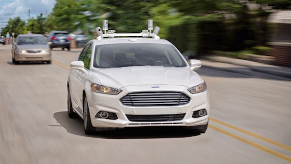 A fully autonomous Ford Fusion hybrid makes an appearance on a Michigan street