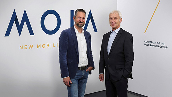 Moia head Ole Harms left and Volkswagen AG CEO Matthias Mueller