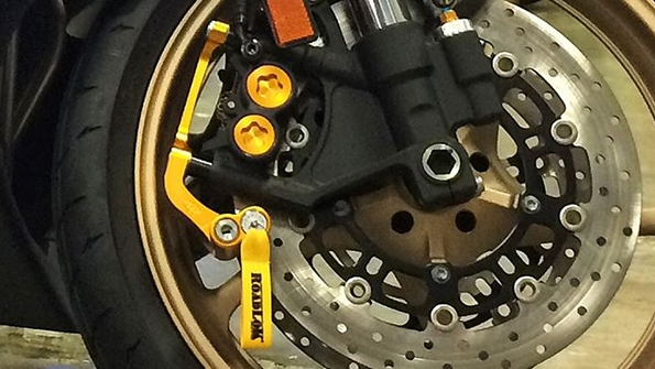 Roadlok devices manufactured in the United States immobilize motorcycles safely and help prevent damage from rolling as well as theft