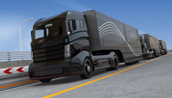 Fleet of autonomous hybrid trucks driving on highway Thinkstock