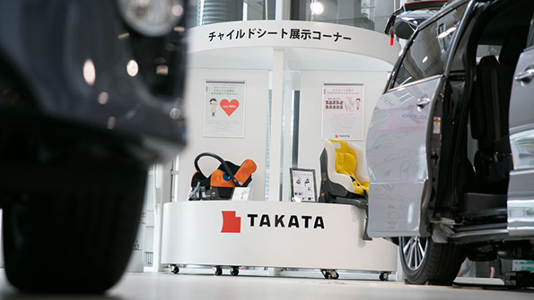Childrens car seats on display in a Takata showroom