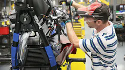 manufacturing worker on assemly line manufacturing worker on assemly line