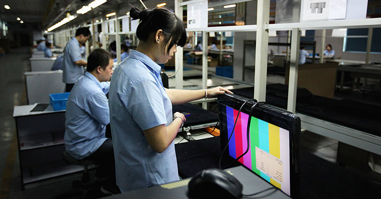 China workers assembling TVs