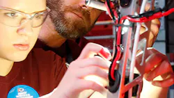 A high school student works on a robot as part of the FIRST Tech Challenge. A high school student works on a robot as part of the FIRST Tech Challenge.