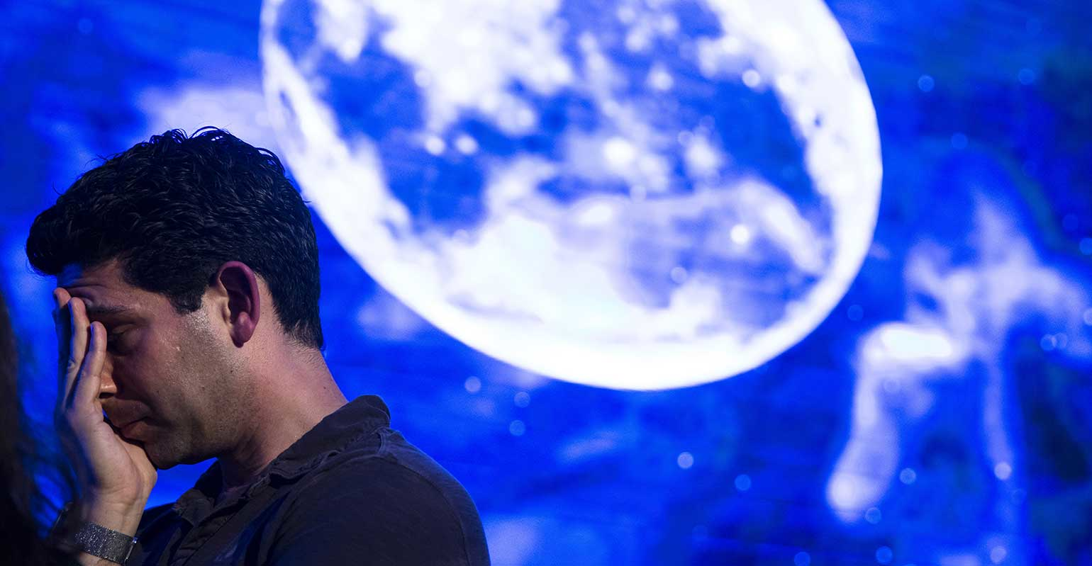 Disappointed man after spacecraft fails to land on the moon.