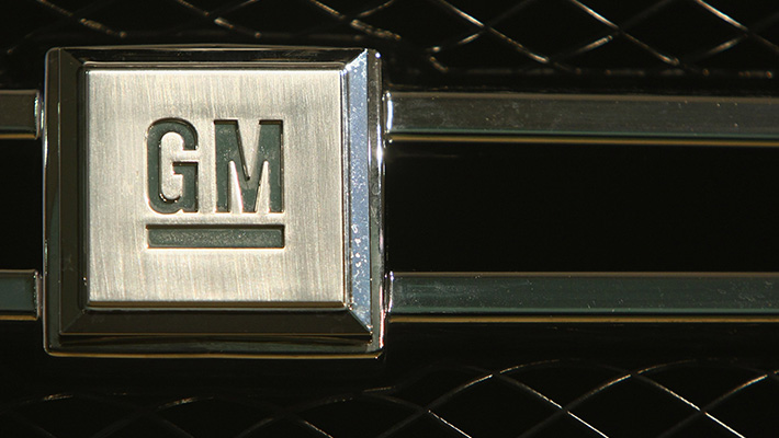 A GM logo on a car grille.