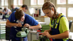 Young engineering students ply their craft and trade. Young engineering students ply their craft and trade.