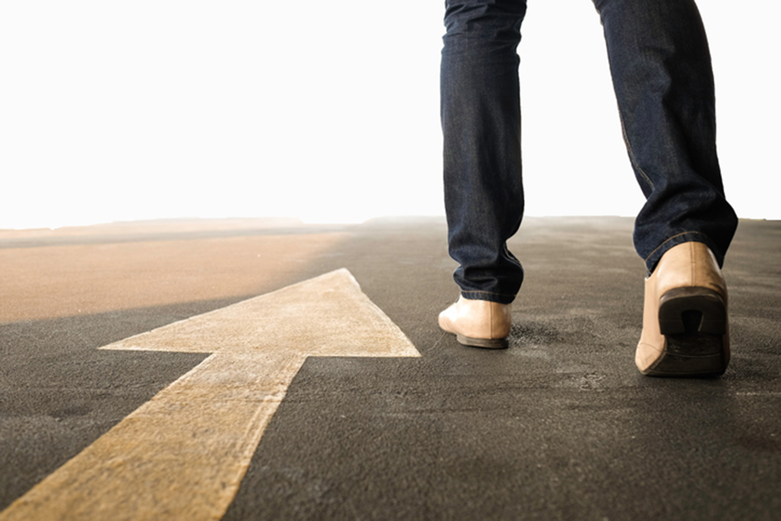 Man walking past forward arrow
