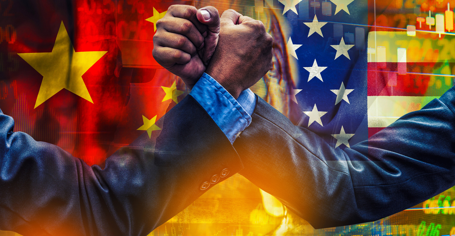 arm wrestling businessmen in front of US and China flags