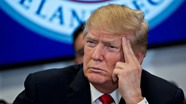 President Donald Trump listens during a February 2018 meeting.