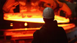 back of guy's head looking at hot steel back of guy's head looking at hot steel