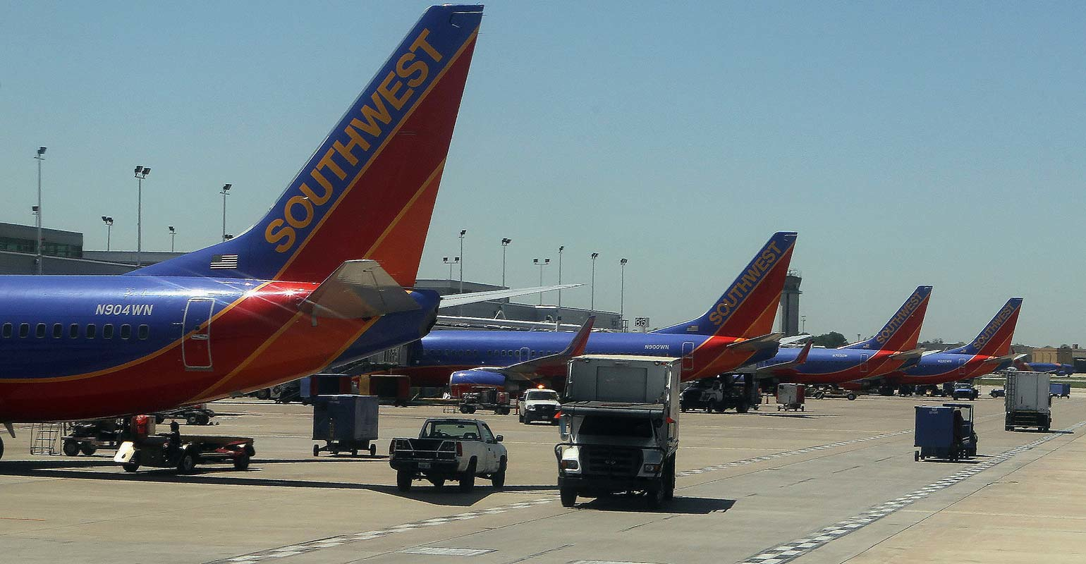 Row of Southwest Airline jets at an airport