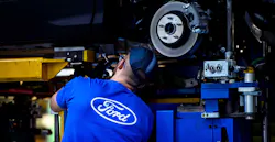 Employee works on Ford Mondeo at factory in Valencia, Spain. Employee works on Ford Mondeo at factory in Valencia, Spain.