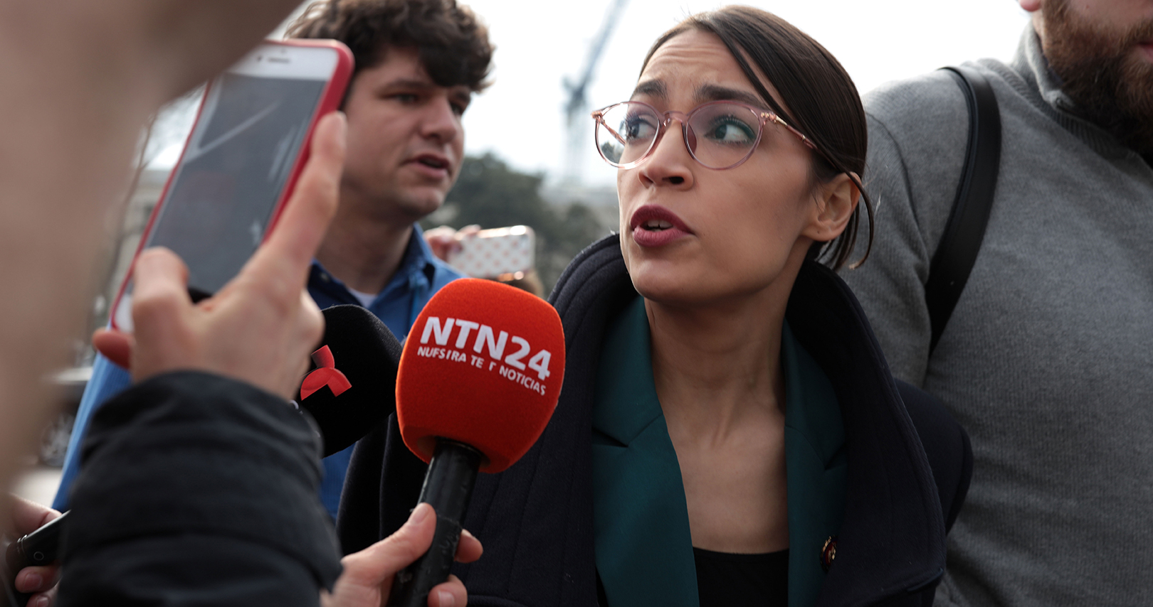 alexandria-ocasio-cortez-mic-alex-wong-getty