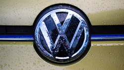 The Volkswagen logo on a car grille The Volkswagen logo on a car grille