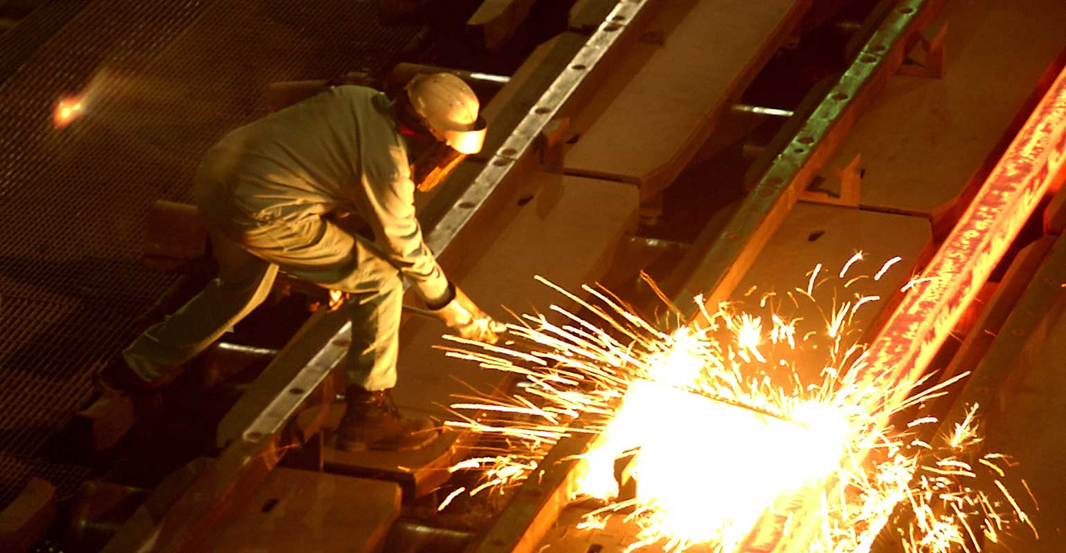 steel-worker-cuts-billet-sparks-david-mcnew-staff-getty-images.jpg