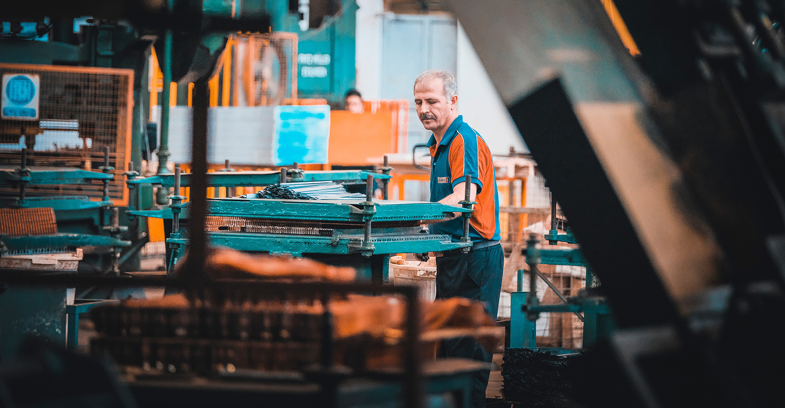 Factory Worker Man Orange Cyan Vest Framed Photo By Sam Moqadam On Unsplash 5e84b3843c9d4