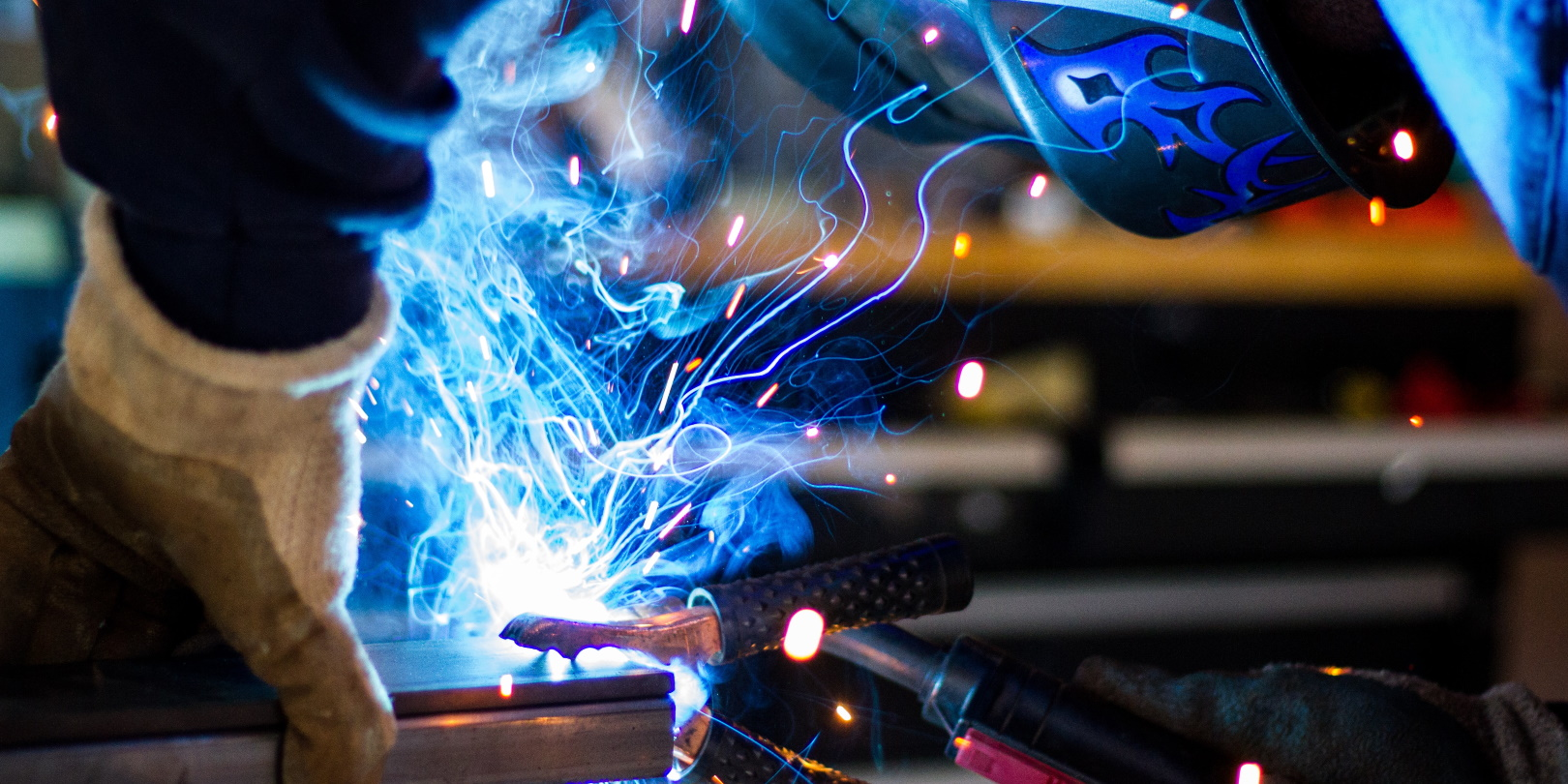 Welding Guy Blue Sparks Rob Lampert Unsplash 5f287508d48dc