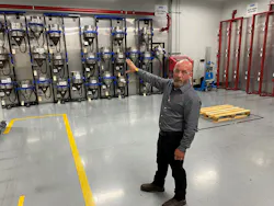 Tony Munger, supervisor in the blanks departments, explains the wall storage handiwork that his team built. Tony Munger, supervisor in the blanks departments, explains the wall storage handiwork that his team built.