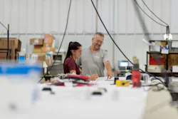 Workers collaborate at MCL Industries in Wisconsin. Workers collaborate at MCL Industries in Wisconsin.