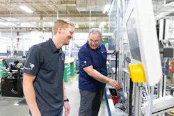 An apprentice at Bosch Charleston, left, with a Bosch trainer. An apprentice at Bosch Charleston, left, with a Bosch trainer.