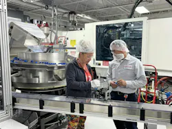 Employees inspect parts at Hoffer Plastics. Employees inspect parts at Hoffer Plastics.