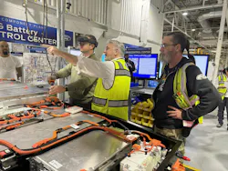 Karl Kostrzewa, controls engineer (middle) and James Massey, senior team leader (right) conduct a walkthrough of the simulation lab in the battery department at the Rawsonville Components Plant. Karl Kostrzewa, controls engineer (middle) and James Massey, senior team leader (right) conduct a walkthrough of the simulation lab in the battery department at the Rawsonville Components Plant.